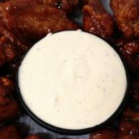 Chicken Wings · Marinated and fried, then tossed in your choice of sauce. Served with celery sticks and choi...