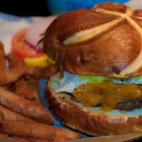 Sneakers House Burger · Eight ounce hand-packed, homemade burger served on a brioche bun with BBQ pulled pork, smoke...