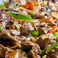 Pepper Steak  · With onions green peppers and brown gravy on a bed of rice