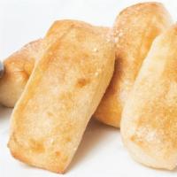 Buddy Bread · Basket of Buddy’s famous oven-baked soft garlic sticks. Served with marinara sauce.