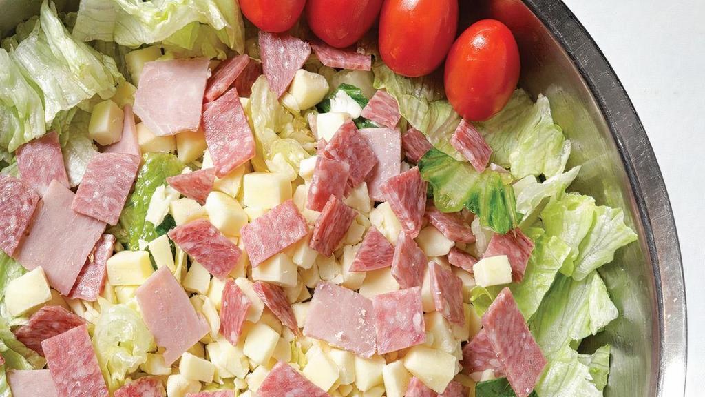 Antipasto · The original Buddy’s salad. Freshly chopped romaine and iceberg lettuce topped with imported ham, salami and Wisconsin brick cheese.