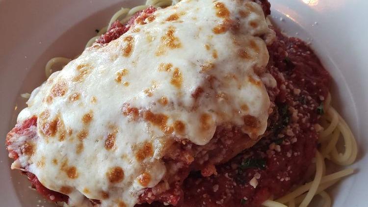 Chicken Parmesan · Breaded chicken breast baked with marinara & fresh mozzarella, served with spaghetti.