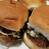 Three Little Pigs · 3 BBQ Pork Sliders topped with cole slaw and served with pickles on the side.