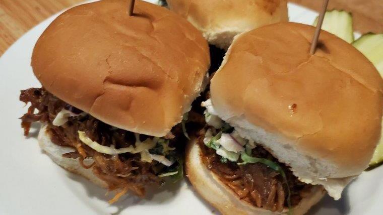 Three Little Pigs · 3 BBQ Pork Sliders topped with cole slaw and served with pickles on the side.