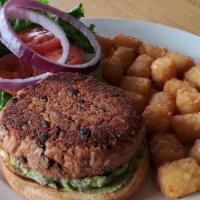 Veggie Black Bean Burger · Our house made black bean, peppers & rice patty topped with house made guacamole, lettuce & ...