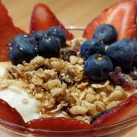 Yogurt Parfait (Vegetarian) · Greek Yogurt topped with strawberries, blueberries, granola & chipotle agave.  A sweet, heal...