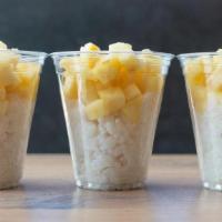 Pineapple Sticky Rice · our Thai-inspired dessert: white rice mixed with house-made coconut sauce + fresh pineapple