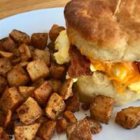 Country Sammie · buttermilk biscuit, maple bacon, scrambled egg, colby-jack
Choice of herbed home fries or fr...