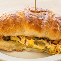 Pepper & Egg · butter croissant, scrambled eggs with roasted red & poblano peppers, chihuahua cheese
Choice...