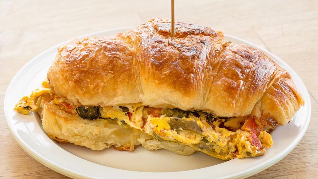 Pepper & Egg · butter croissant, scrambled eggs with roasted red & poblano peppers, chihuahua cheese
Choice of side. All sammies can be made vegetarian.