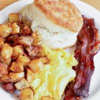 Traditional · two sunny up eggs, turkey sausage or maple roasted bacon, herbed home fries, buttermilk bisc...