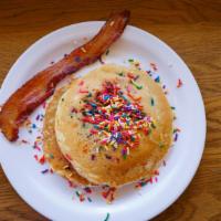 Funfetti Shortstack · two buttermilk sprinkle pancakes, one maple bacon, seasonal fruit cup