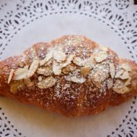 Almond Croissant · Our classic croissant filled with house almond almond paste and made sweet with simple syrup...
