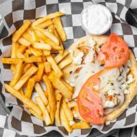 Greek Chicken Pita · Grecian chicken breast with onions, tomato, feta, and tzatziki sauce.  Served with fries.