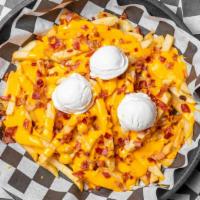 3 Layer Fries · Chopped bacon, melted cheddar cheese, and sour cream.