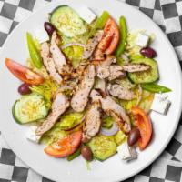 Greek Salad · Onions, tomatoes, Greek olives tossed in our homemade Greek dressing and topped with feta ch...