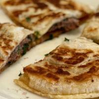 Chinese Pancake · Pan-fried Pancake Filled with Ground Beef or Pork with Chinese Chives.