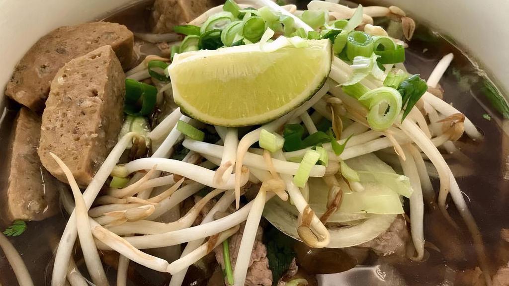Pho (Vietnamese Beef Noodle Soup) · Served with Thick Rice Noodles, Sliced Beef and Meatball , Thai Basil, Bean Sprouts, Cilantro, Lime and Jalapeno Pepper in a Tasty Clear Beef Soup.