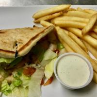 Chicken Pita · Char-grilled chicken breast, Swiss cheese, lettuce and tomatoes served on a pita. Choice of ...