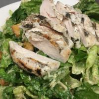 Chicken Caesar Salad · Fresh crisp romaine topped with home-style croutons, creamy Caesar dressing and parmesan che...