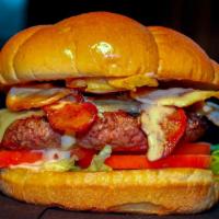 Dublin · Burger char-grilled with swiss cheese, sautéed onions, hickory smoked bacon and Malone's own...