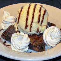 Ghiradelli Brownie · Warm homemade brownie topped with ice cream and drizzled with chocolate sauce.