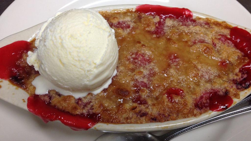 Cherry Cobbler · Warm cherry cobbler  served with Hudsonville ice cream.