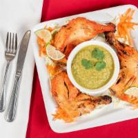Tandoori Chicken (Half) · Chicken marinated in yogurt and mild spices, cooked in its own juices over red hot charcoal,...