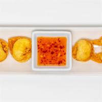 Crab Rangoon · Six pieces. Crab meat, cream cheese and celery in a crispy wonton and our sweet and sour sau...