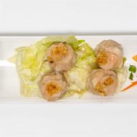 Shumai · Four jumbo pieces. Shrimp dumplings served with an intense soy sauce. Choice of steamed or d...