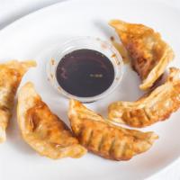 Dumplings (5) · Steamed or deep-fried served with soy sauce.
