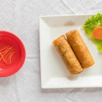 Egg Rolls (2) · Crispy fried egg rolls with ground pork, chicken, taro, crab meat and carrot; served with fi...