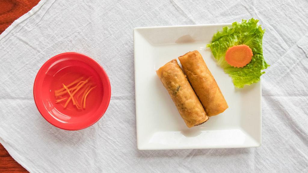 Egg Rolls (2) · Crispy fried egg rolls with ground pork, chicken, taro, crab meat and carrot; served with fish sauce and lettuce.