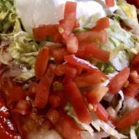 Deluxe Burrito · 2 burritos, 1 chicken and beans & 1 beef and beans both topped with red sauce, lettuce, toma...