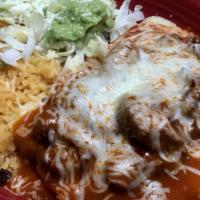 Enchiladas Rancheras · 3 cheese enchiladas topped with pork carnitas, red sauce, served with rice and guacamole sal...