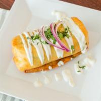 Chimichanga · Large flour tortilla wrapped with meat and choice of fillings. Served with beans, cheese, le...