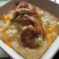 Jerk Shrimp & Grits · With jerk marinated shrimp & our savory cheese grits.  Includes white or wheat toast