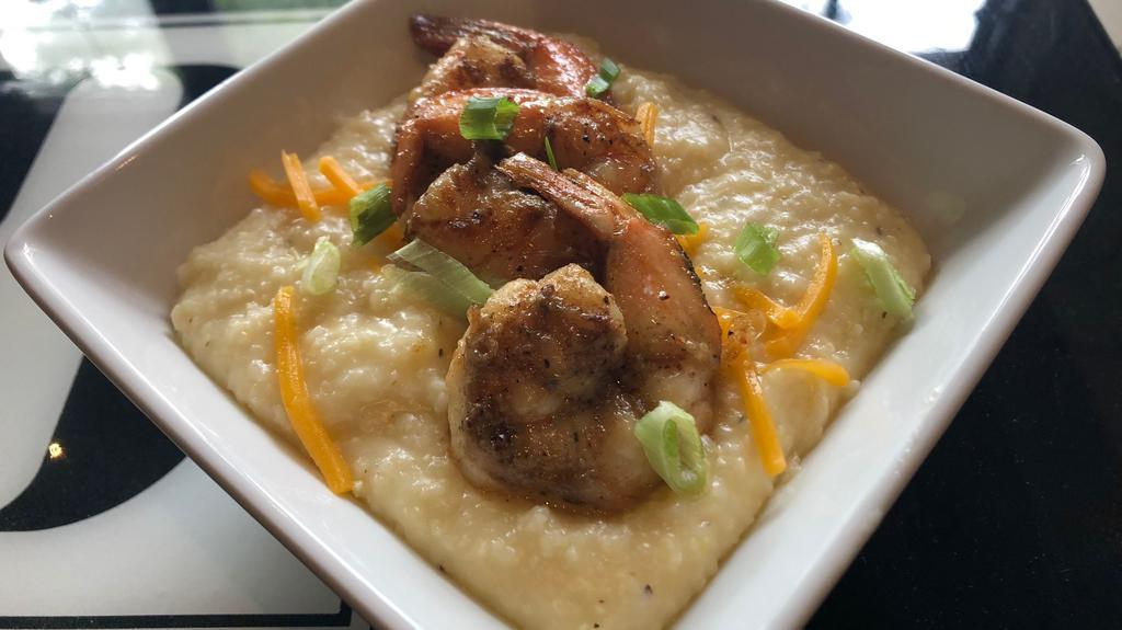 Jerk Shrimp & Grits · With jerk marinated shrimp & our savory cheese grits.  Includes white or wheat toast