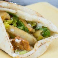 Chicken Shish Taouk Sandwich · Favorite. Chicken marinated in garlic with lettuce, pickles, homemade garlic spread and frie...