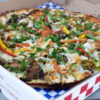 Beef Shawarma Pizza · Dough topped with fresh shredded cheese, seasoned hand cut beef with chopped parsley, tomato...