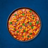 Chickpea Supreme · Chickpeas, slow-cooked till soft in an onion and tomato curry with Indian whole spices. Serv...