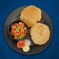 Chole Bhature · (4 Pcs )Whole wheat flatbread, deep-fried till crisp and golden. Served with chickpeas curry.