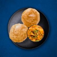 Aloo Puri · (2 Pcs)Whole wheat flatbread, deep-fried till crisp and golden. Served with potato curry.