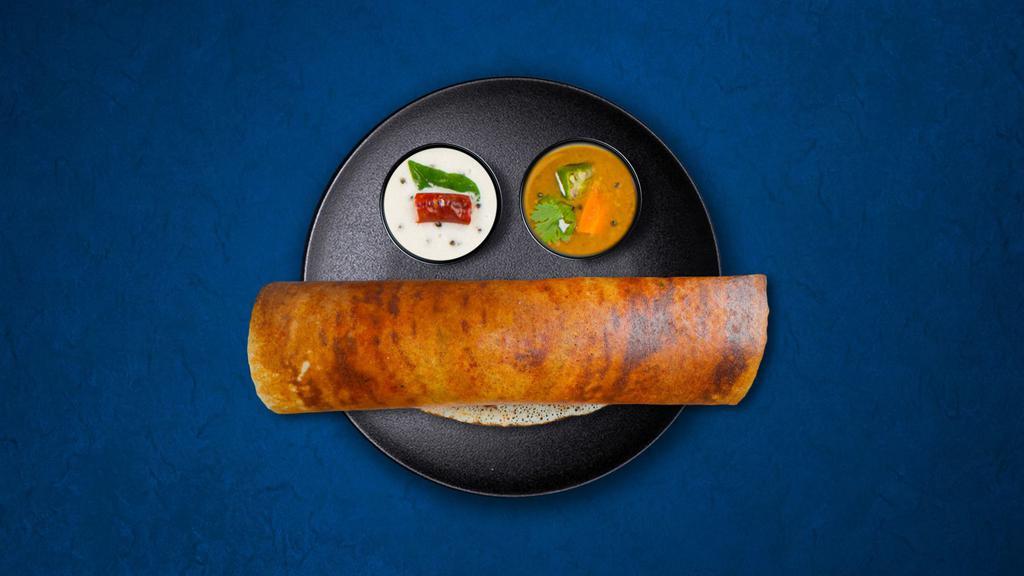 Gunpowder Dosa · A thin crepe made from a fermented batter of lentils and rice, layered with Gun Powder (condiment made fromÂ lentils, sesame seeds, chilies, cumin, coriander, and other spices). Served with lentil soup, house special tangy and savory relish.