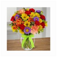 Light & Lovely · Yellow daisies, orange Peruvian lilies, lavender matsumoto asters, orange carnations and red...