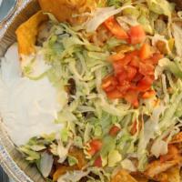 #71. Nachos Supreme · Toasted corn tortilla chips covered with a delicious blend of melted cheese, beef, chicken a...