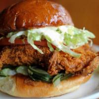 Hot Mother Clucker · Fried chicken thigh tossed in Tennessee hot sauce.  Shredded lettuce, tomato, B&B pickle mix...