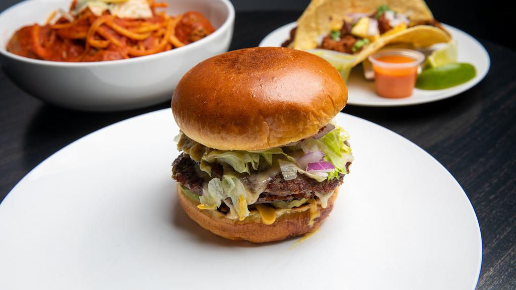 Chitown Burger · Two Prime Beef 4oz. Patties | Lettuce | Pickle | Onion | Secret Sauce | White American Cheese | Brioche Bun