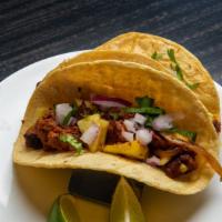 Al Pastor Taco · Spit grilled pork, grilled pineapple. cilantro, grilled onions and corn tortilla