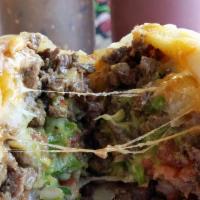 California Burrito · Servido con guacamole, queso y papas. / Served with guacamole, cheese & fries.